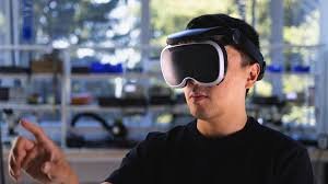 Man wearing a VR headset, interacting with a virtual environment.