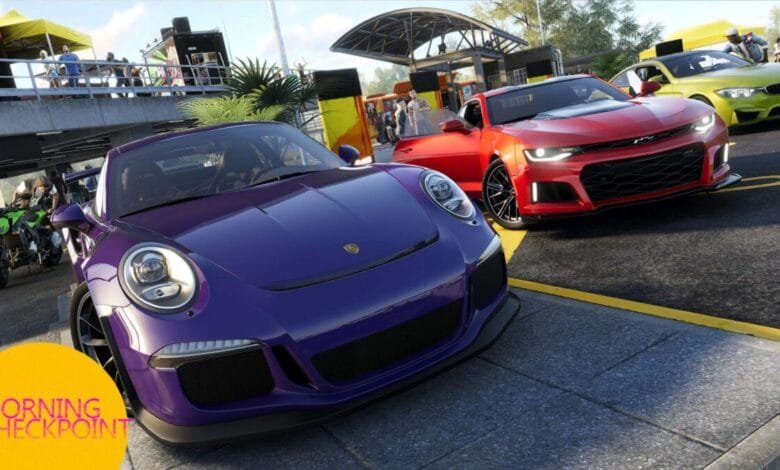 A purple Porsche and a red Camaro parked at a sunny outdoor checkpoint, with other cars and people in the background.