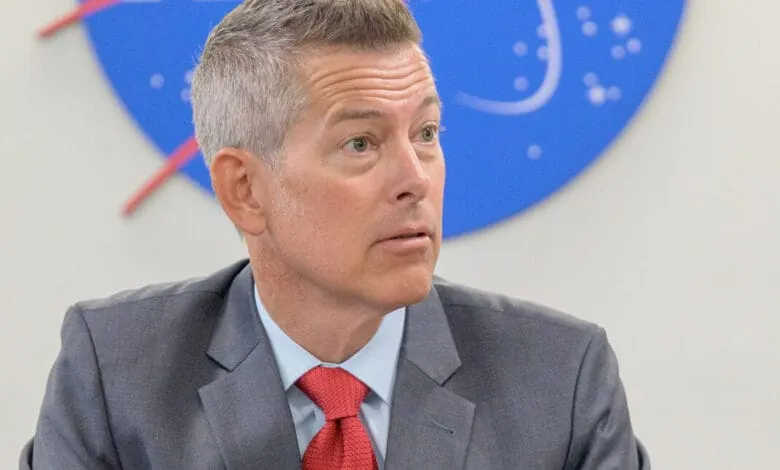 Close-up of Sean Duffy, Acting Chief of NASA, logo backdrop.