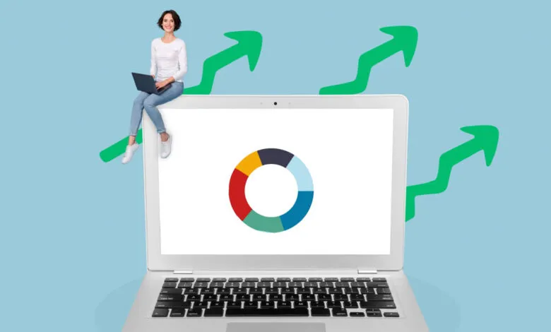 Woman sits on giant laptop screen with pie chart and upward arrows, symbolizing growth and success in online business.