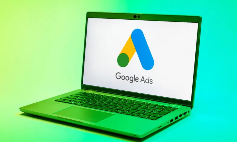 Google Ads logo displayed on a laptop screen against a vibrant green background.