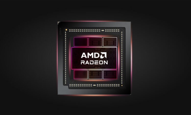 Close-up of an AMD Radeon graphics processing unit (GPU) with pink and orange lighting accents.