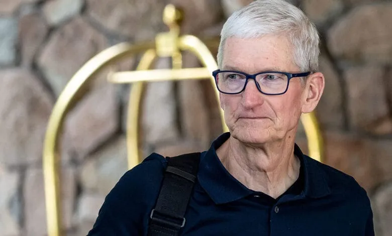 Tim Cook, Apple CEO, at the Allen & Co. Sun Valley Conference, wearing glasses and a dark polo shirt.