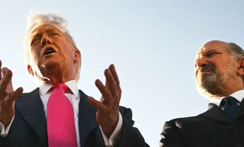 Donald Trump and Robert Kraft speaking outdoors, low angle shot.