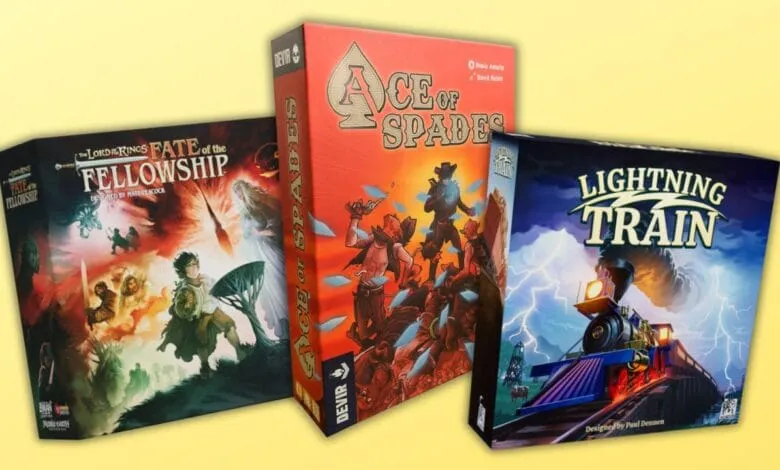 Three board game boxes: Lord of the Rings Fate of the Fellowship, Ace of Spades, and Lightning Train. Fantasy, Western, and train themes.