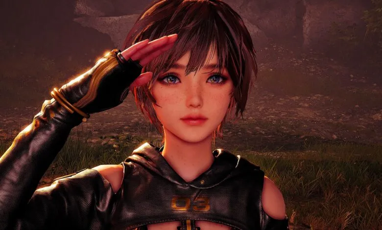 Female video game character salutes; freckles, short brown hair, futuristic outfit.