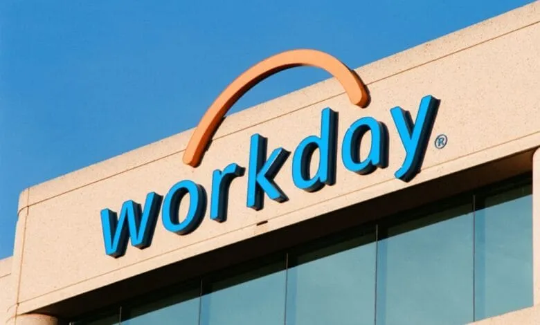Workday logo on a tan building, bright blue lettering with an orange arc above.