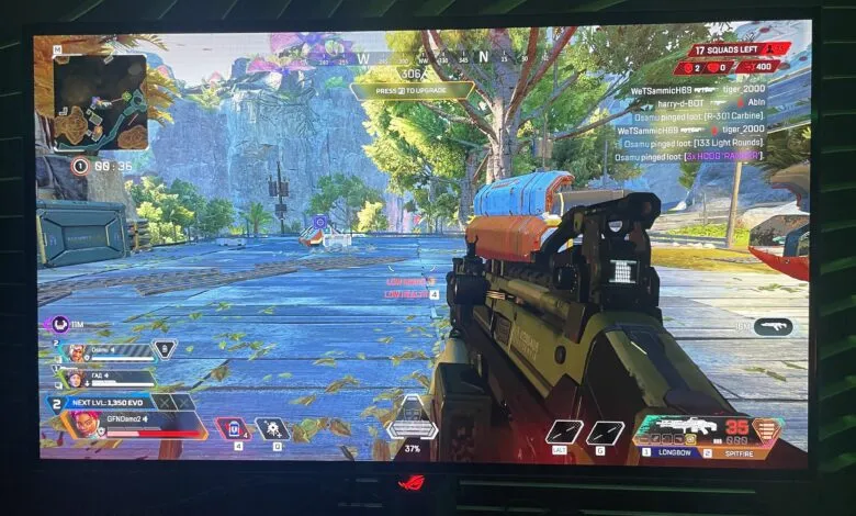 Apex Legends player aiming R-301 Carbine, low health, in a vibrant jungle environment.