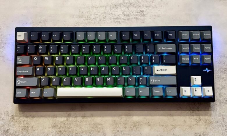 Custom mechanical keyboard with RGB backlighting, showcasing a unique keycap arrangement and color scheme.