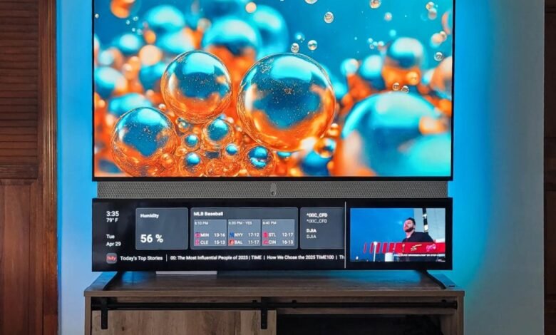 A modern television displaying vibrant abstract art and a news ticker with weather and sports updates.