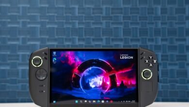 Lenovo Legion Go handheld gaming PC with vibrant screen displaying a futuristic landscape.