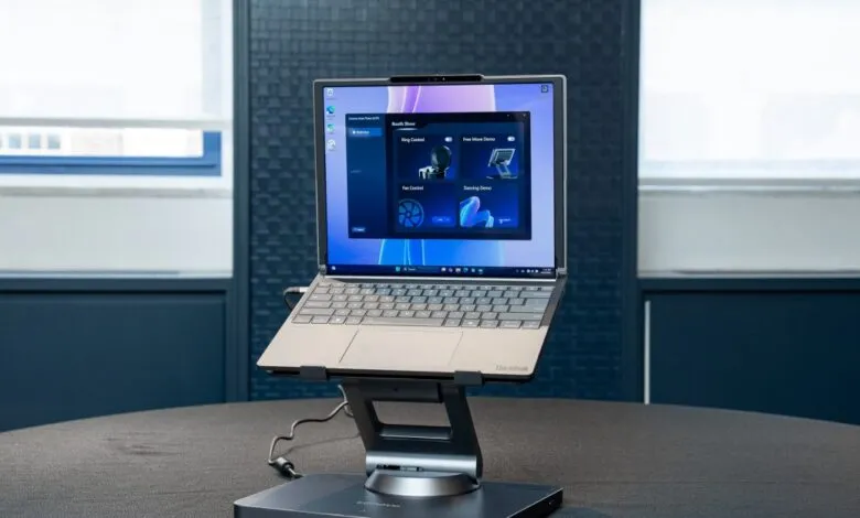 Lenovo ThinkBook laptop on a stand, showcasing Smart Motion software interface.