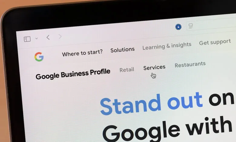 Close-up of a laptop screen displaying the Google Business Profile website.