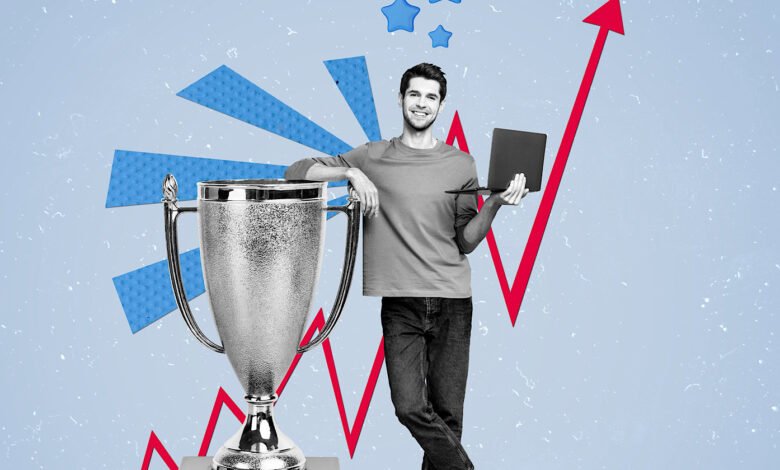 Young businessman stands proudly beside a trophy, laptop in hand, against a backdrop of upward trending graphs and blue accents.
