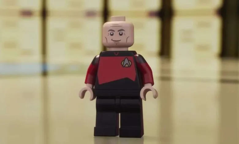 Lego minifigure of Captain Jean-Luc Picard in his Starfleet uniform.