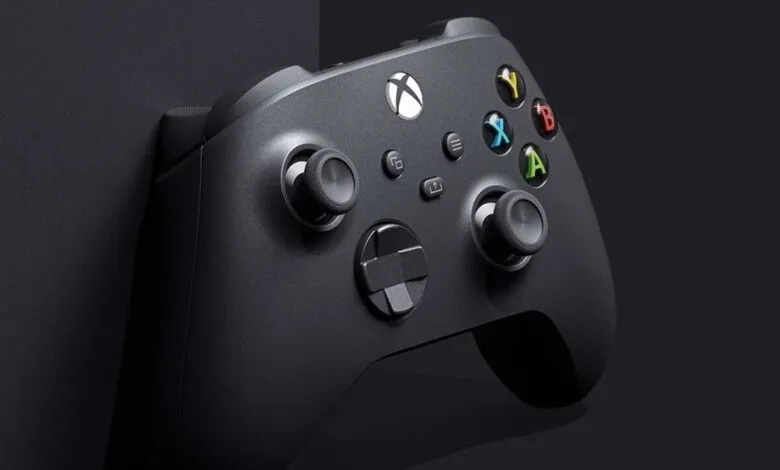 Close-up of a sleek, black Xbox Series X controller, showcasing its buttons and design.