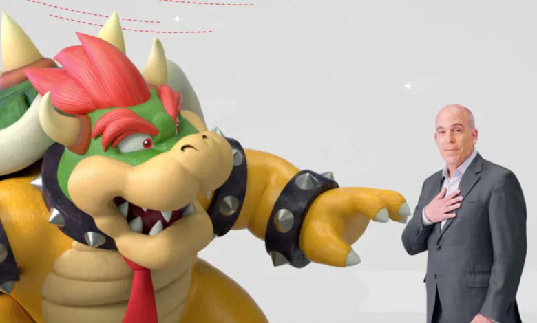 Bowser from Super Mario and a man in a suit interacting.