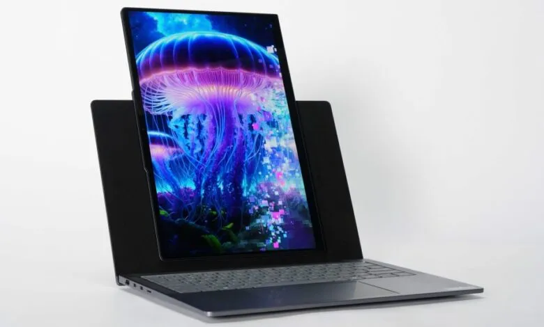 Modern laptop with a unique dual-screen design displaying a vibrant jellyfish.