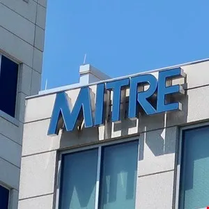 MITRE Corporation logo on a building exterior.