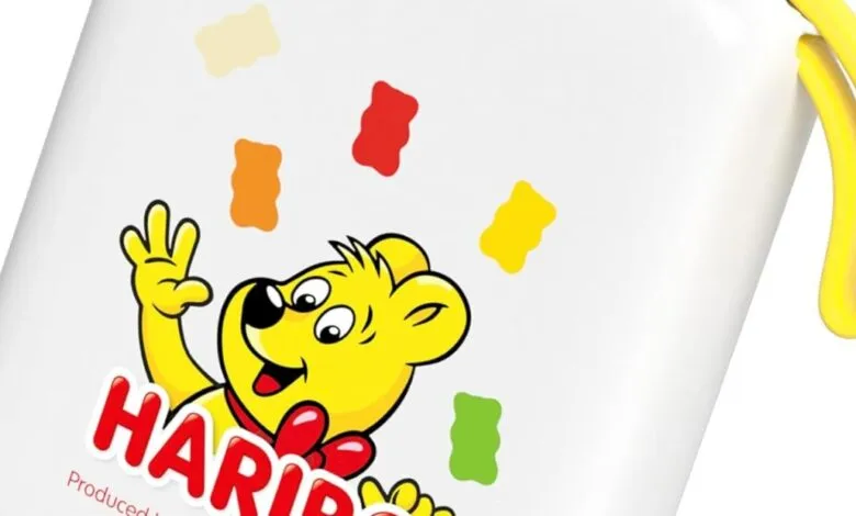 White Haribo gummy bear container with yellow handle and gummy bears illustration.
