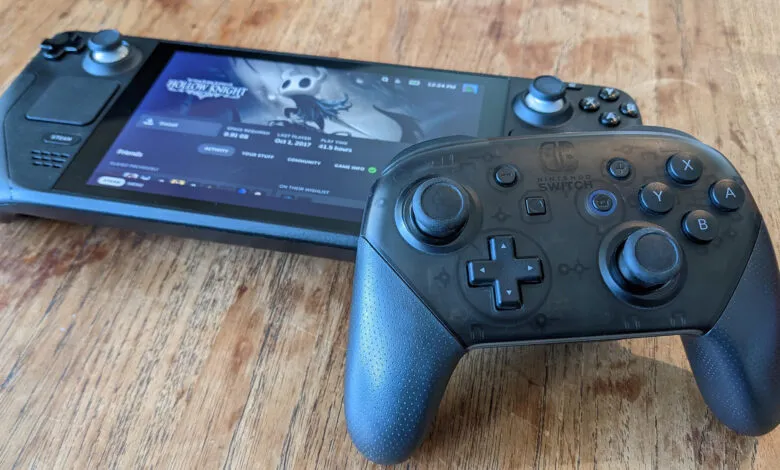 Steam Deck and Nintendo Switch controller on a wooden table, playing Hollow Knight.