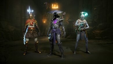 Three fantasy characters in dark, ancient setting. One wears gold, one dark armor, one light blue.
