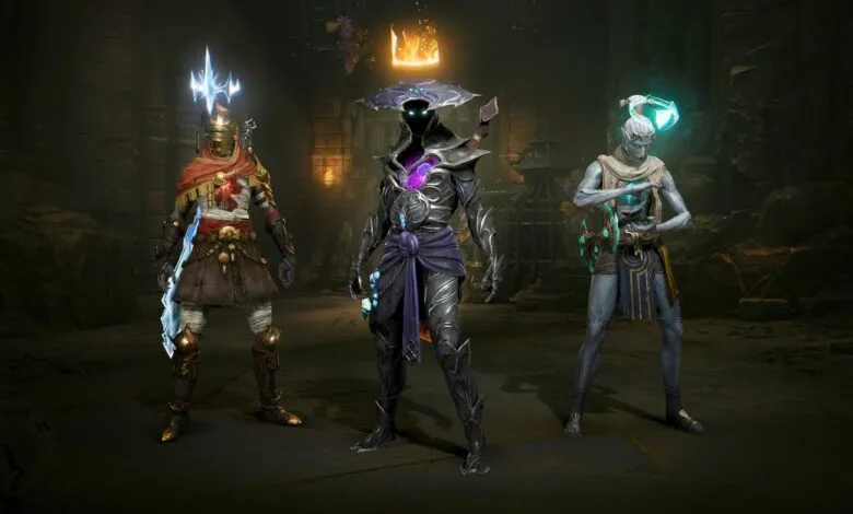 Three fantasy characters in dark, ancient setting. One wears gold, one dark armor, one light blue.