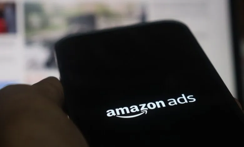 Close-up of a smartphone screen displaying the Amazon Ads logo.