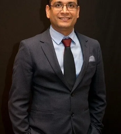 Anuj Budhiraja, VP of Additive Manufacturing at Phillips Machine Tools, in a professional portrait.