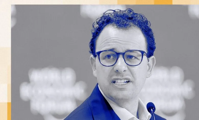 Headshot of Dario Amodei, CEO of Anthropic, in blue tone.