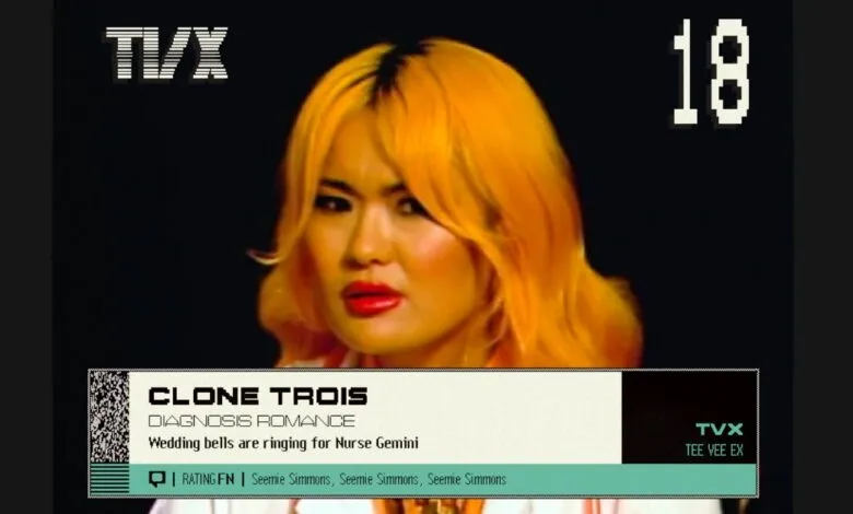 Woman with bright orange hair and red lipstick on a dark background, with TVX branding.