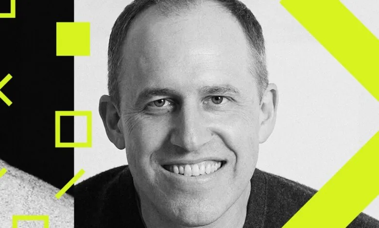 Black and white portrait of Bret Taylor, former CEO of Salesforce, with a vibrant yellow design element.