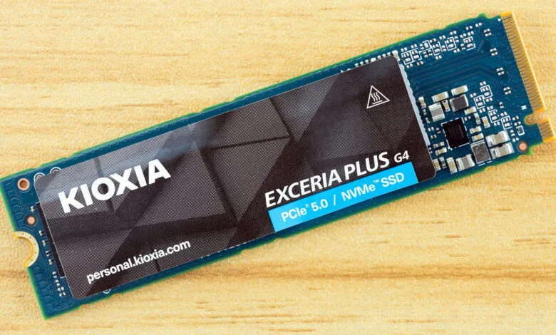 Kioxia Exceria Plus G4 PCIe 5.0 NVMe SSD on a wooden surface.