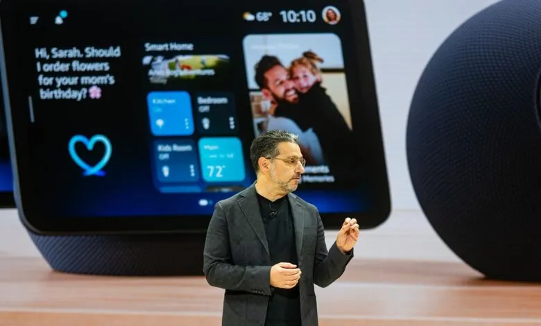 Man in a suit presenting a smart home display and speaker.