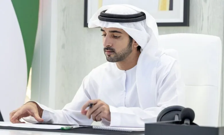 Sheikh Hamdan bin Mohammed Al Maktoum, Crown Prince of Dubai, working at a desk.