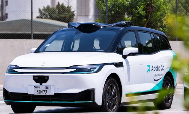 White autonomous vehicle with Apollo Go branding and sensors on the roof.