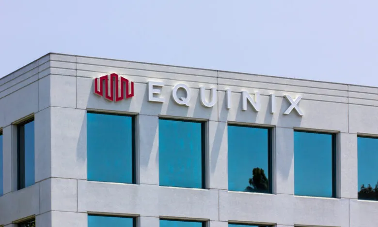 Close-up of the Equinix logo and building exterior with blue-tinted windows.