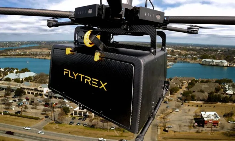 Flytrex drone delivering package over suburban area.