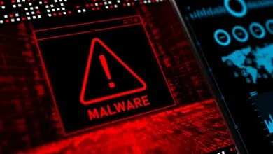 Malware alert warning on a computer screen, red triangle with exclamation point.