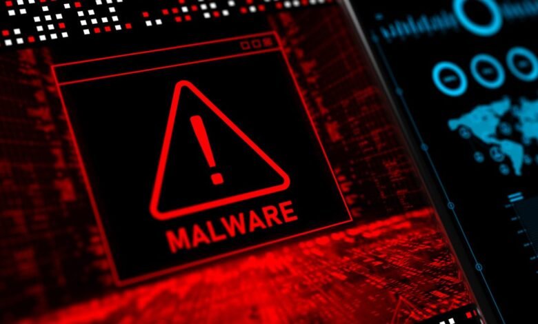 Malware alert warning on a computer screen, red triangle with exclamation point.