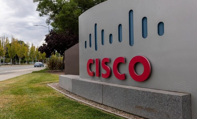 Cisco Systems logo on a large gray sign outside a building.