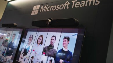 Microsoft Teams logo displayed on a screen showing a virtual meeting at ISE 2024 in Barcelona.