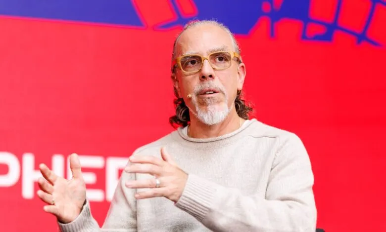 Marc Benioff, Salesforce CEO, speaks at a conference, gesturing with his hands.