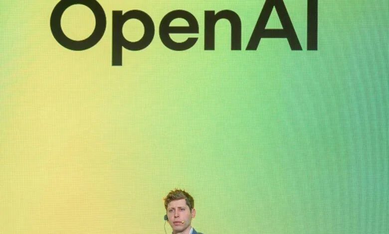 Sam Altman, OpenAI CEO, speaks at a presentation with the OpenAI logo displayed prominently behind him.