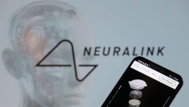 Smartphone displays Neuralink's patient registry against a blurred background of the Neuralink logo and a stylized brain.