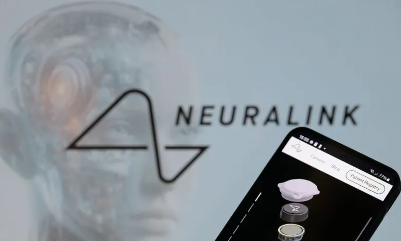Smartphone displays Neuralink's patient registry against a blurred background of the Neuralink logo and a stylized brain.