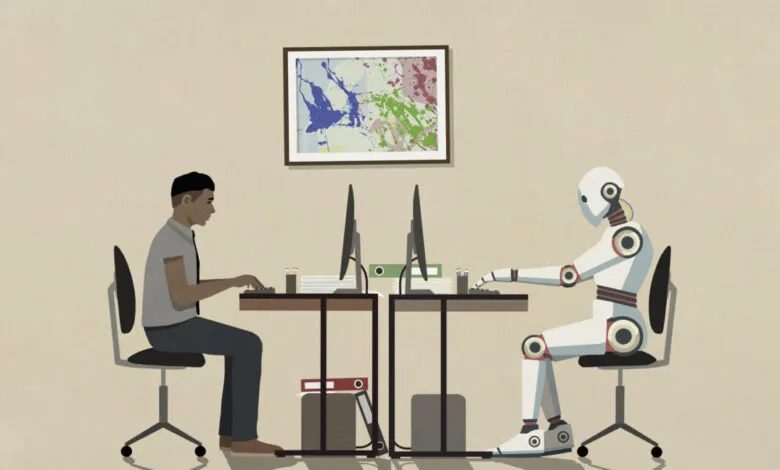Human and robot coworker side-by-side at office computers.
