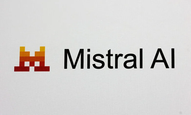 Mistral AI logo: a pixelated castle-like icon and the company name in black sans-serif font on a light gray background.