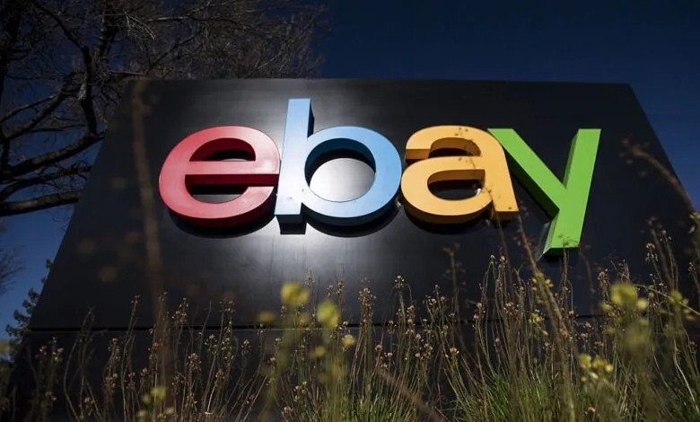 eBay logo on a black sign at company headquarters.