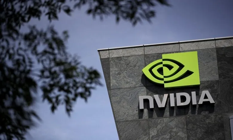 NVIDIA logo and name on a modern building exterior against a blue sky.